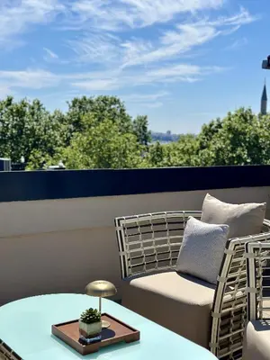 a balcony with a couch and a table at Weingart Suites Hotel in Istanbul