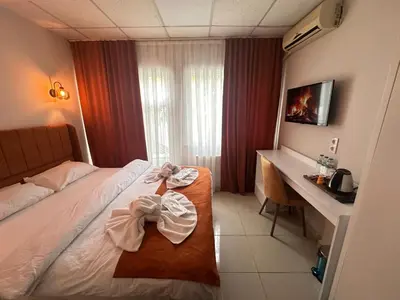 a hotel room with a bed and a desk at Kadıköy Bull Hotel in Istanbul