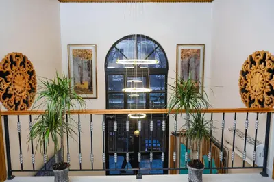 a room with a staircase with a blue glass door at Elmira Pera Hotel & - Special Class in Istanbul