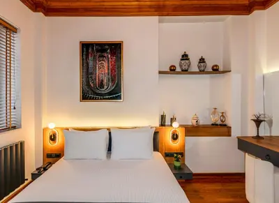 a bedroom with a white bed with two lamps at Elmira Pera Hotel & - Special Class in Istanbul