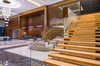 a lobby with a staircase in a building at Crowne Plaza Yalova by IHG in Yalova