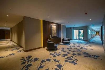 a lobby with couches and chairs in a building at Crowne Plaza Yalova by IHG in Yalova