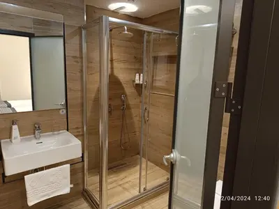 a bathroom with a shower and a sink at Sultanahmet Newport Hotel in Istanbul
