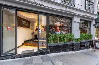 a store front with glass windows on a street at Sultanahmet Newport Hotel in Istanbul