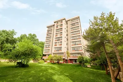 an apartment building with a lawn in front of it at The Marmara Camlica in Istanbul