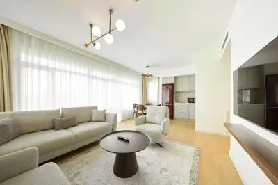 a living room with a couch and a table at The Marmara Camlica in Istanbul