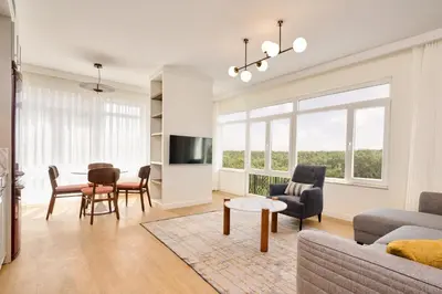 a living room with a couch and a table at The Marmara Camlica in Istanbul
