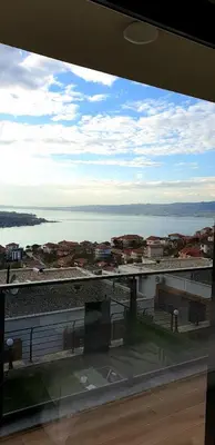 a view from a window of a city and water at فلل التن تاج ALTINTAC villalari in Sapanca