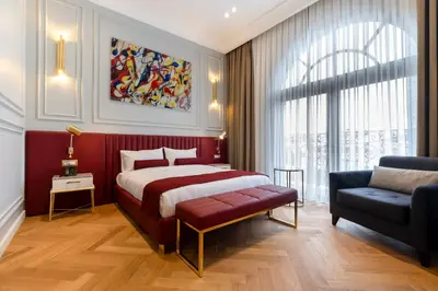 a bedroom with a king sized bed and a couch at New Inn Hotel Old Town in Istanbul