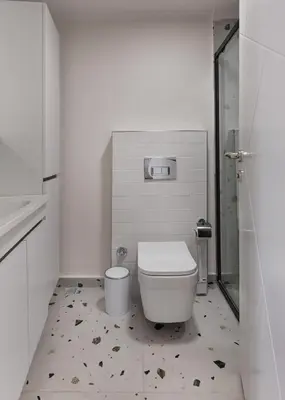 a white bathroom with a toilet and a shower at Allegro Apartments Kadıköy in Istanbul