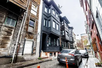 a car parked in front of a black building at Deluxe Double Room 4 in Istanbul