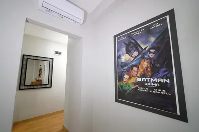 a poster for batman returns on a wall in a room at Meet İstanbul Hotel Kadikoy in Istanbul