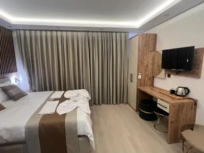 a hotel room with a bed and a desk at Ninova Boutique Hotel in Istanbul