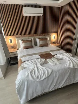 a bedroom with a large bed with white sheets and pillows at Ninova Boutique Hotel in Istanbul