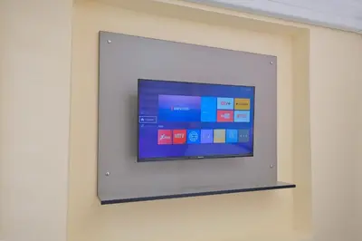 a flat screen tv on a wall at Lucky Hotel İstanbul in Istanbul