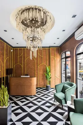 a lobby with a chandelier and a waiting room at Marlon Hotel in Istanbul