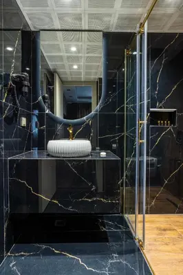 a bathroom with a sink and a mirror at Marlon Hotel in Istanbul