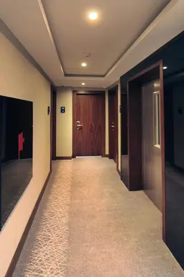 a hallway with a corridor with a door and a corridorngthngthngthngthngth at Pisa Hotel in Istanbul