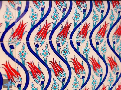 a pattern of blue and red flowers on a wall at Taksim FunHouse in Istanbul