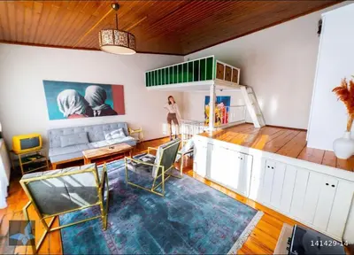 a living room with a couch and a table at Taksim FunHouse in Istanbul