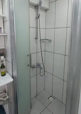 a shower with a glass door in a bathroom at Hane Apart in Istanbul