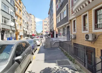 a city street with cars parked on the sidewalk at Hane Apart in Istanbul
