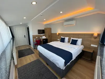 a bedroom with a large bed in a room at The Blue Suites in Istanbul