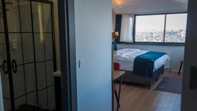a bedroom with a bed and a window at The Blue Suites in Istanbul