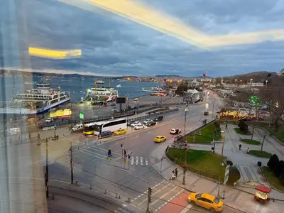 a city with cars and traffic on a street at Manesol Old City Bosphorus in Istanbul