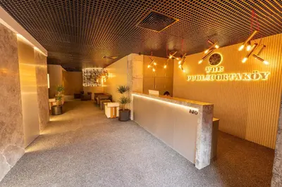 a lobby of a dermatology office with a sign on the wall at The Public Ortakoy in Istanbul