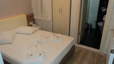 a hotel room with a bed with towels on it at Kadikoy Bade 3 Hotel in Istanbul