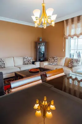 a living room with a couch and a table at Serbesler Botanik, No 1 Comfortable Villa in Sakarya