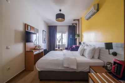 a hotel room with a bed and a television at Elite Marmara Express Otel in Istanbul