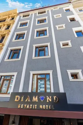 a tall gray building with a sign on it at Diamond Beyazit Hotel in Istanbul