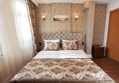 a bedroom with a large bed in a room at Rose Apartments in Istanbul