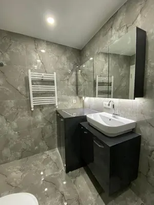 a bathroom with a sink and a mirror at Stay in the heart of the city in Istanbul
