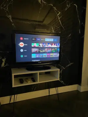 a flat screen tv sitting on a tv stand at Stay in the heart of the city in Istanbul
