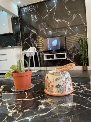 a living room with a counter with a television and a purse at Stay in the heart of the city in Istanbul