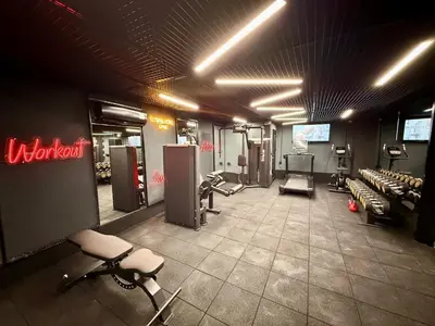 a gym with chairs and machines in a room at Elysian Airport Hotel & Restaurant in Arnavutköy