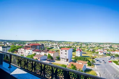 a view of a city from a balcony at Elysian Airport Hotel & Restaurant in Arnavutköy