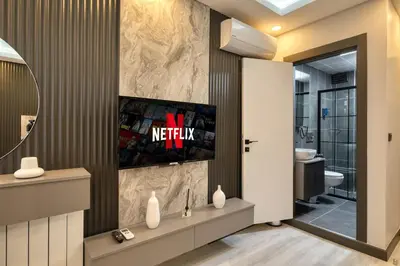 a bathroom with a tv on a wall at Swans Hotel Old City Grand Bazar in Istanbul
