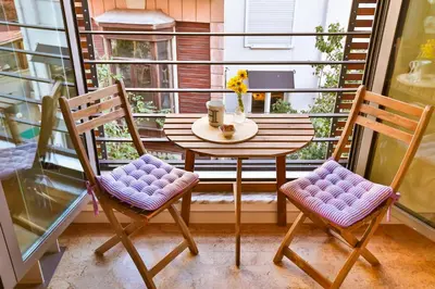 a small table and two chairs on a balcony at Hammamhane Hotel in Istanbul