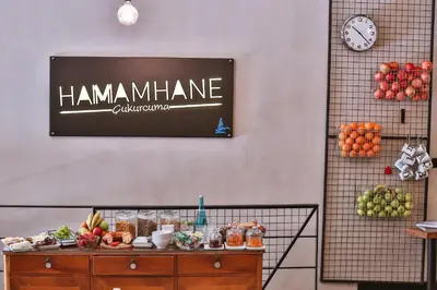 a sign that reads hamannamine on a wall with fruit at Hammamhane Hotel in Istanbul