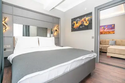 a bedroom with a large bed and a couch at 216 Style Suite in Istanbul