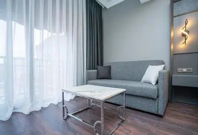 a living room with a couch and a coffee table at 216 Style Suite in Istanbul