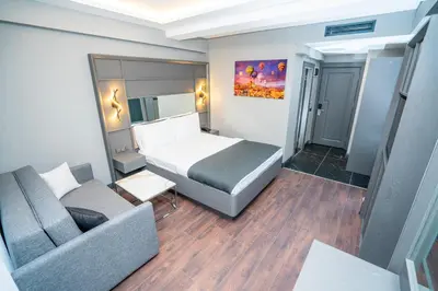 a small room with a bed and a couch at 216 Style Suite in Istanbul