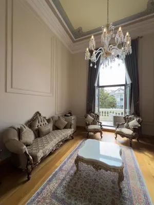 a living room with a couch and a chandelier at Ring Stone Hotels Old City - Special Class in Istanbul