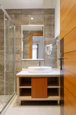 a bathroom with a sink and a shower at Nishant Hotel in Istanbul