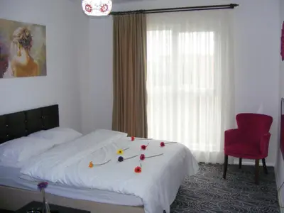 a bedroom with a bed with fruit on it at KAT11 in Beylikduzu