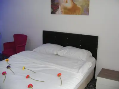 a bed with flowers on it in a bedroom at KAT11 in Beylikduzu